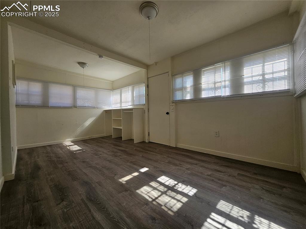 1138 Pine Street Pueblo, CO 81004 - Photo 20 of 22 a view of empty room with wooden floor