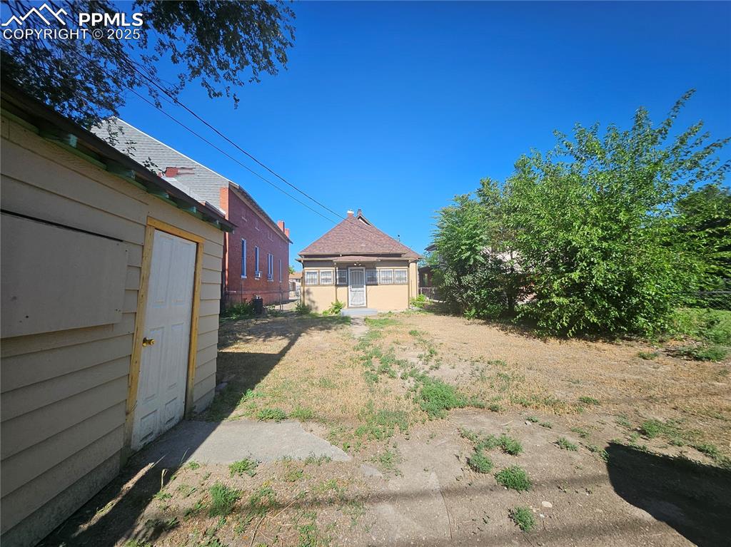 1138 Pine Street Pueblo, CO 81004 - Photo 22 of 22 a view of a house with a yard