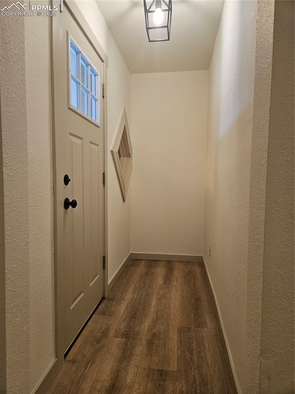 1138 Pine Street Pueblo, CO 81004 - Photo 5 of 22 a view of a hallway with wooden floor