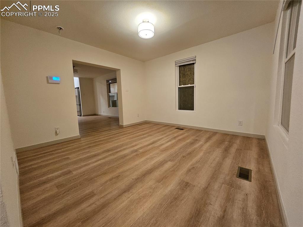 1138 Pine Street Pueblo, CO 81004 - Photo 7 of 22 a view of an empty room and window