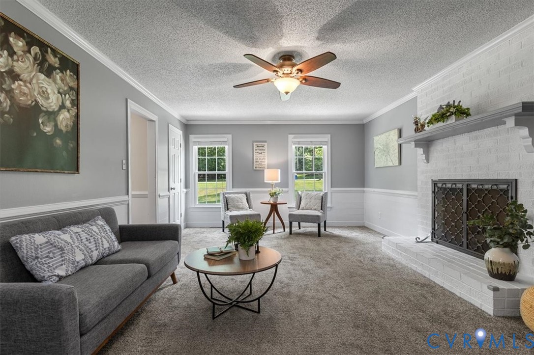 10330 Christina Road Chesterfield, VA 23832 - Photo 17 of 39 a living room with furniture and a fireplace