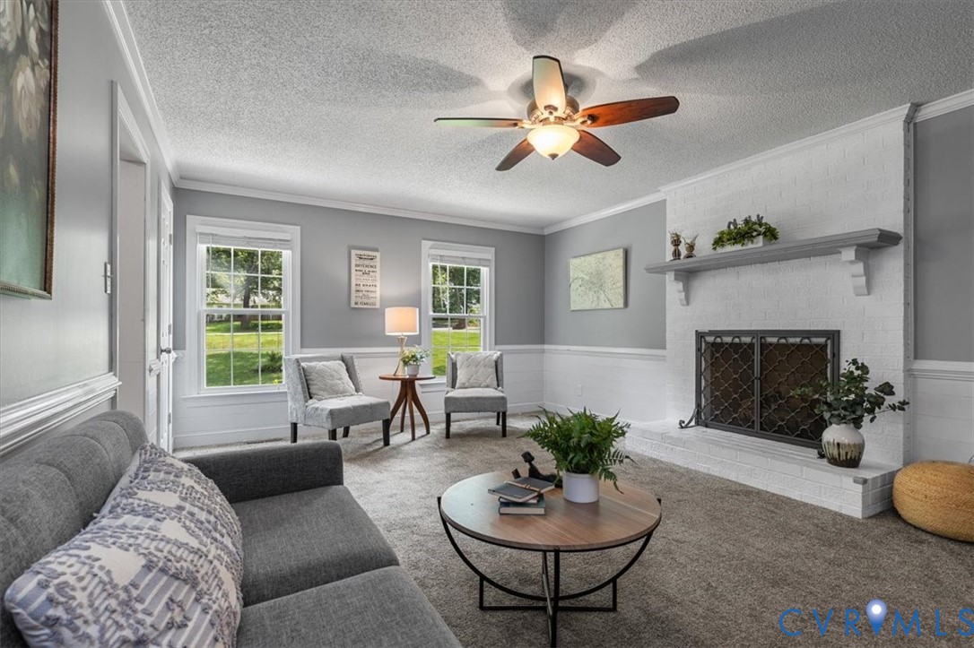 10330 Christina Road Chesterfield, VA 23832 - Photo 18 of 39 a living room with furniture a fireplace and a large window