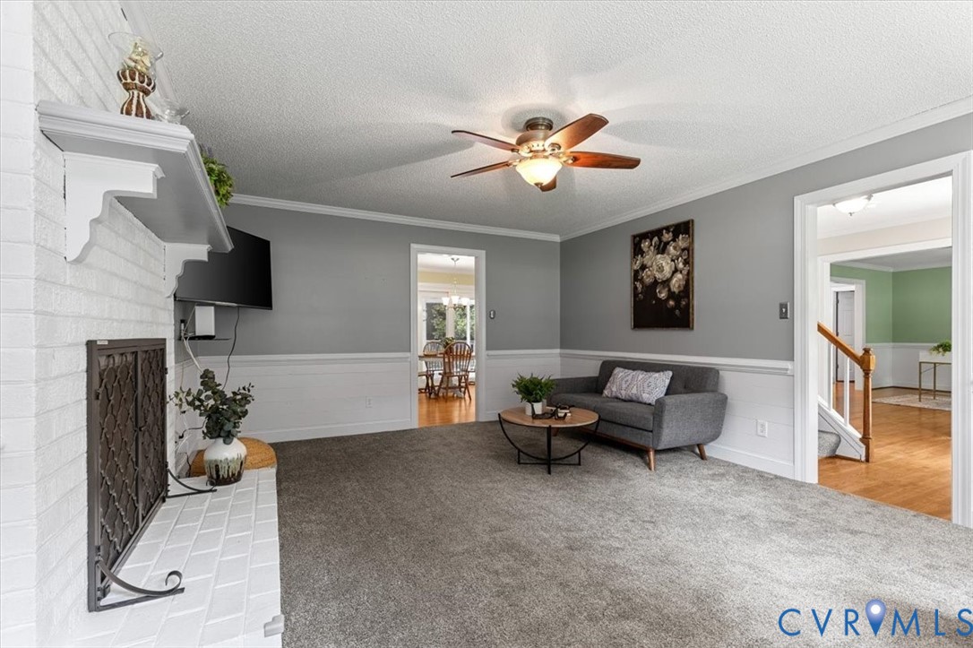 10330 Christina Road Chesterfield, VA 23832 - Photo 20 of 39 a living room with furniture and a chandelier