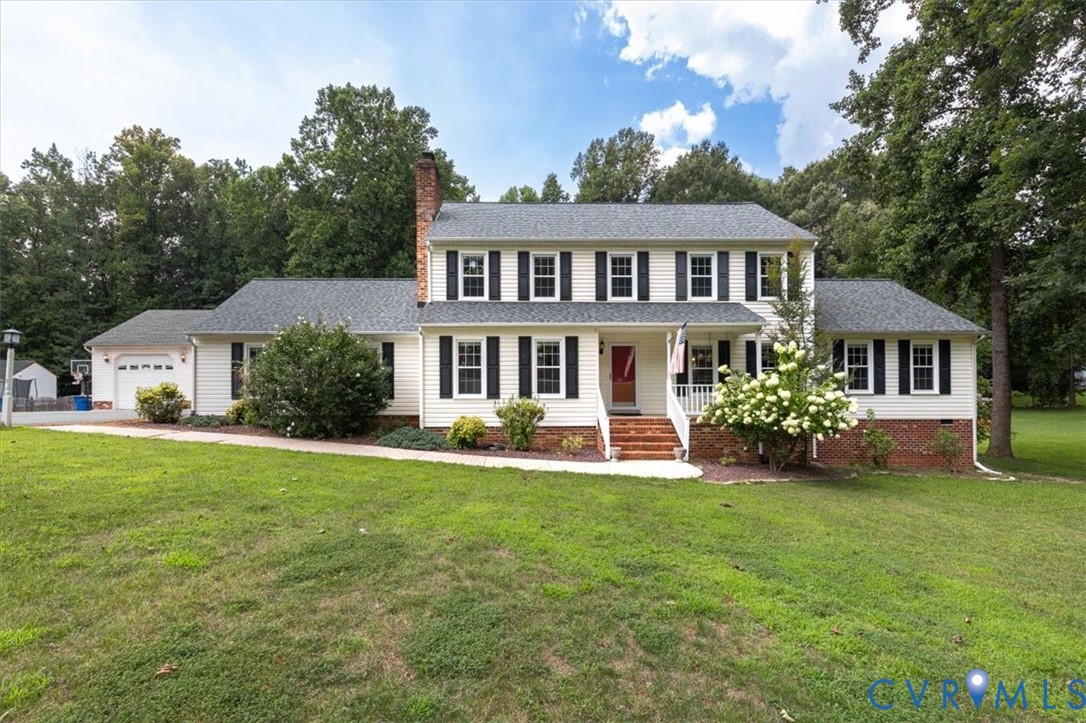 10330 Christina Road Chesterfield, VA 23832 - Photo 2 of 39 a front view of a house with a garden