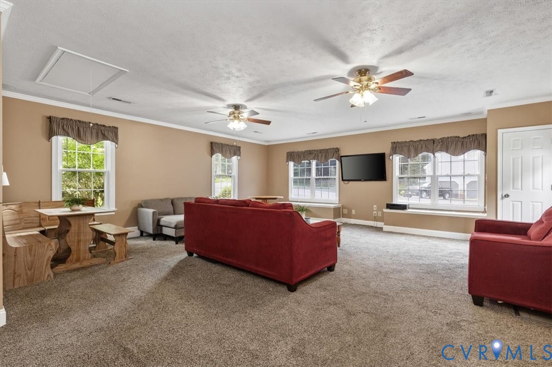 10330 Christina Road Chesterfield, VA 23832 - Photo 23 of 39 a living room with furniture and a large window