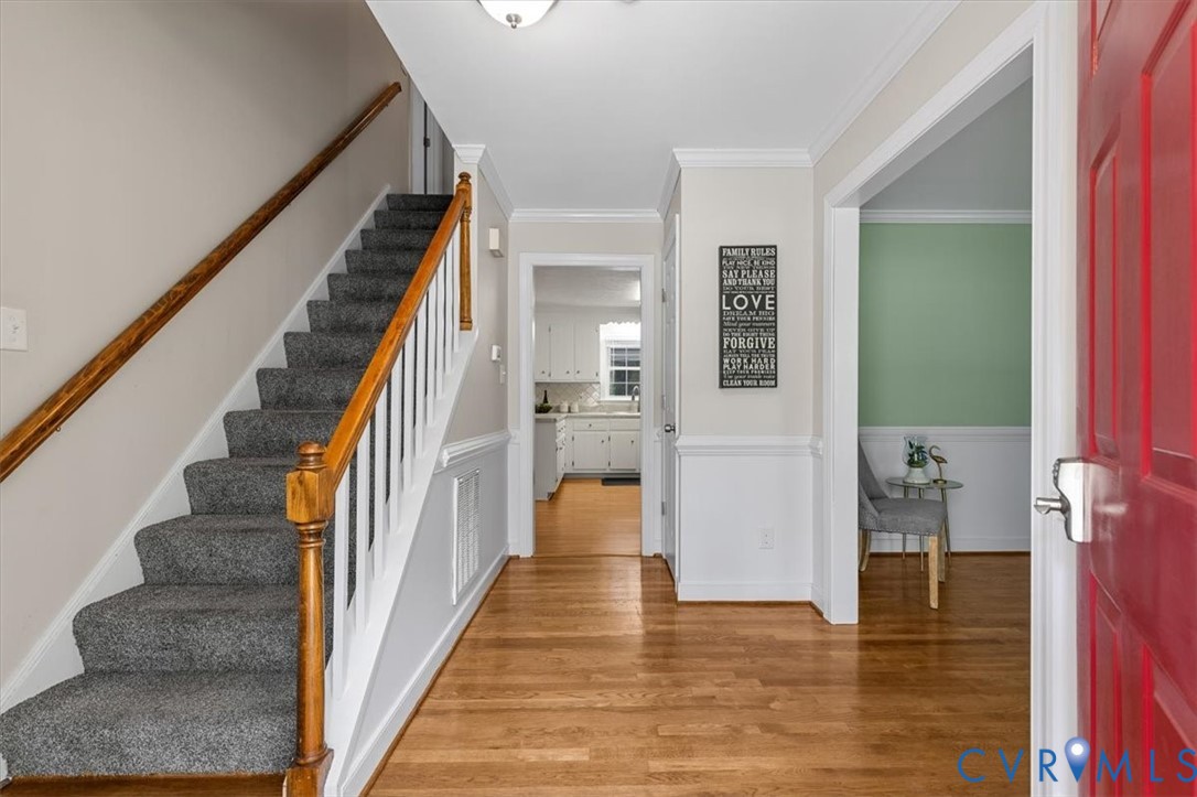 10330 Christina Road Chesterfield, VA 23832 - Photo 4 of 39 a view of hallway with wooden floor and staircase