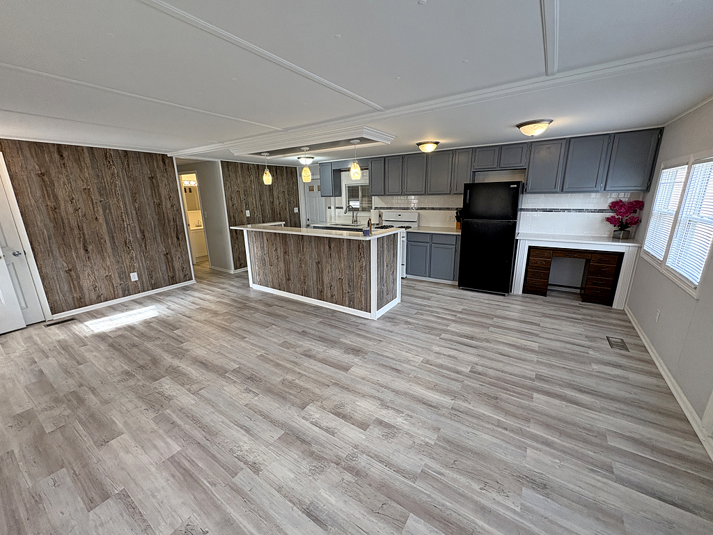 1134 Lakeview Road Elgin, IL 60123 - Photo 9 of 26 a kitchen with stainless steel appliances kitchen island wooden cabinets and granite counter tops