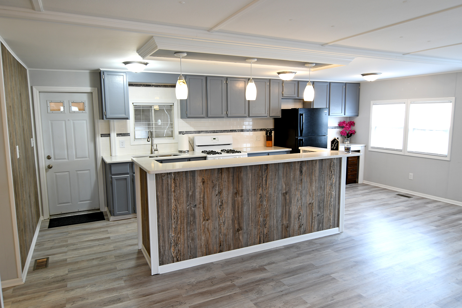 1134 Lakeview Road Elgin, IL 60123 - Photo 10 of 26 a kitchen with kitchen island a sink dishwasher a stove and a refrigerator with wooden floor