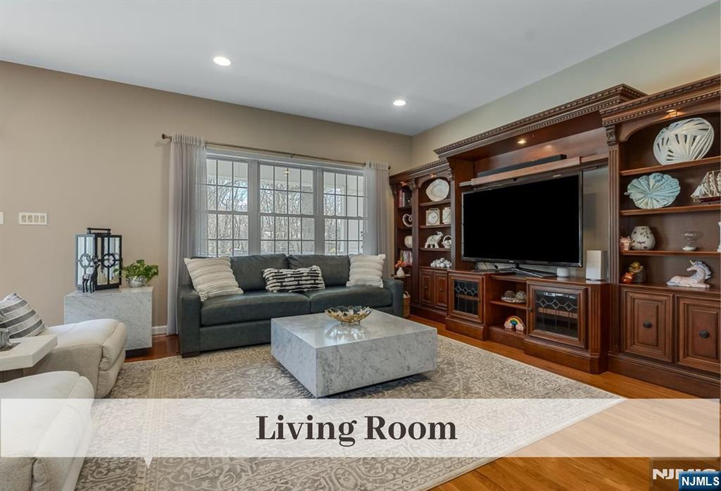 80 West Prospect Street Waldwick, NJ 07463 - Photo 14 of 50 a living room with furniture and a flat screen tv