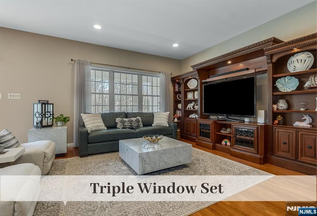 80 West Prospect Street Waldwick, NJ 07463 - Photo 15 of 50 a living room with furniture and a flat screen tv