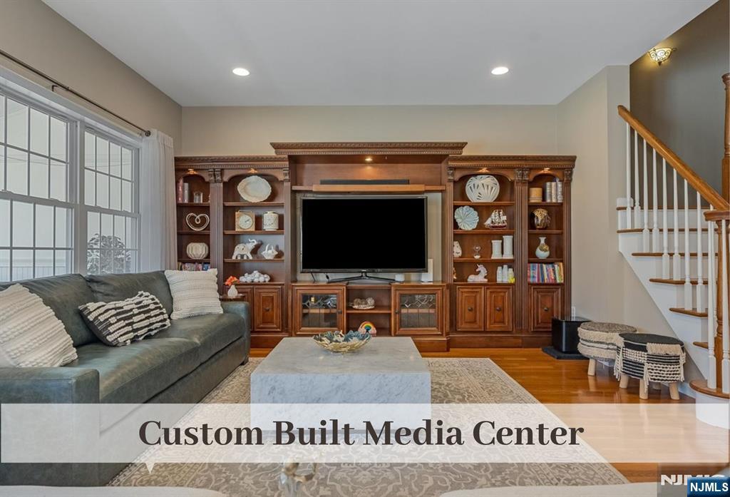 80 West Prospect Street Waldwick, NJ 07463 - Photo 16 of 50 a living room with furniture and a flat screen tv
