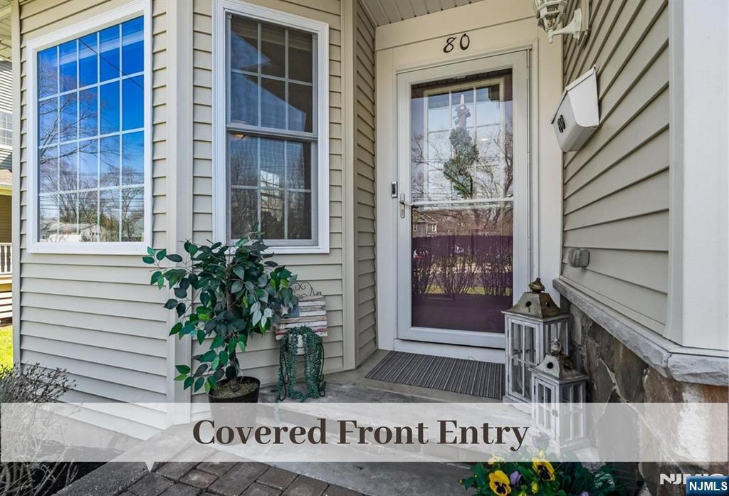 80 West Prospect Street Waldwick, NJ 07463 - Photo 3 of 50 a front view of a house with a yard