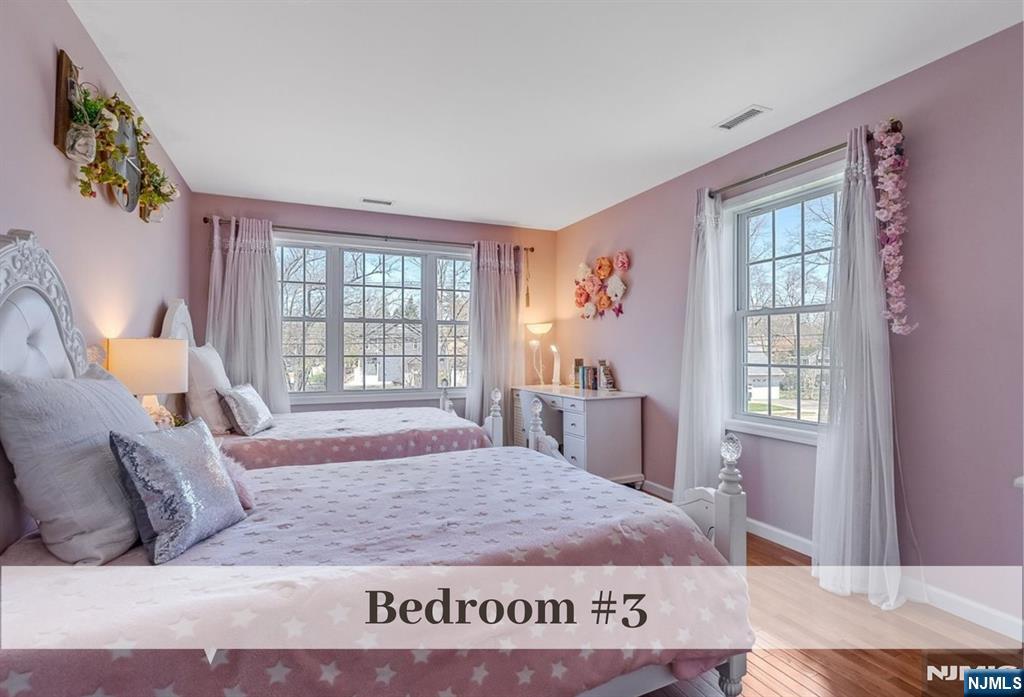 80 West Prospect Street Waldwick, NJ 07463 - Photo 31 of 50 a bed sitting in a bedroom next to a window