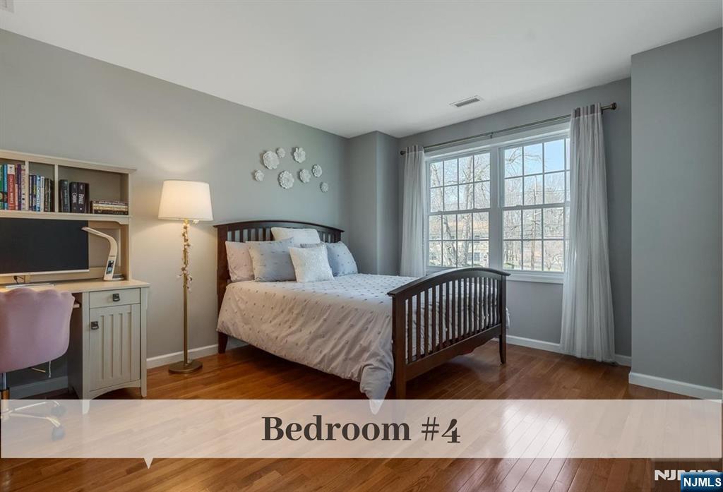 80 West Prospect Street Waldwick, NJ 07463 - Photo 33 of 50 a bedroom with a bed and a window