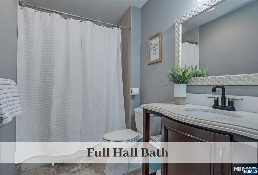 80 West Prospect Street Waldwick, NJ 07463 - Photo 34 of 50 a bathroom with a granite countertop sink and a mirror