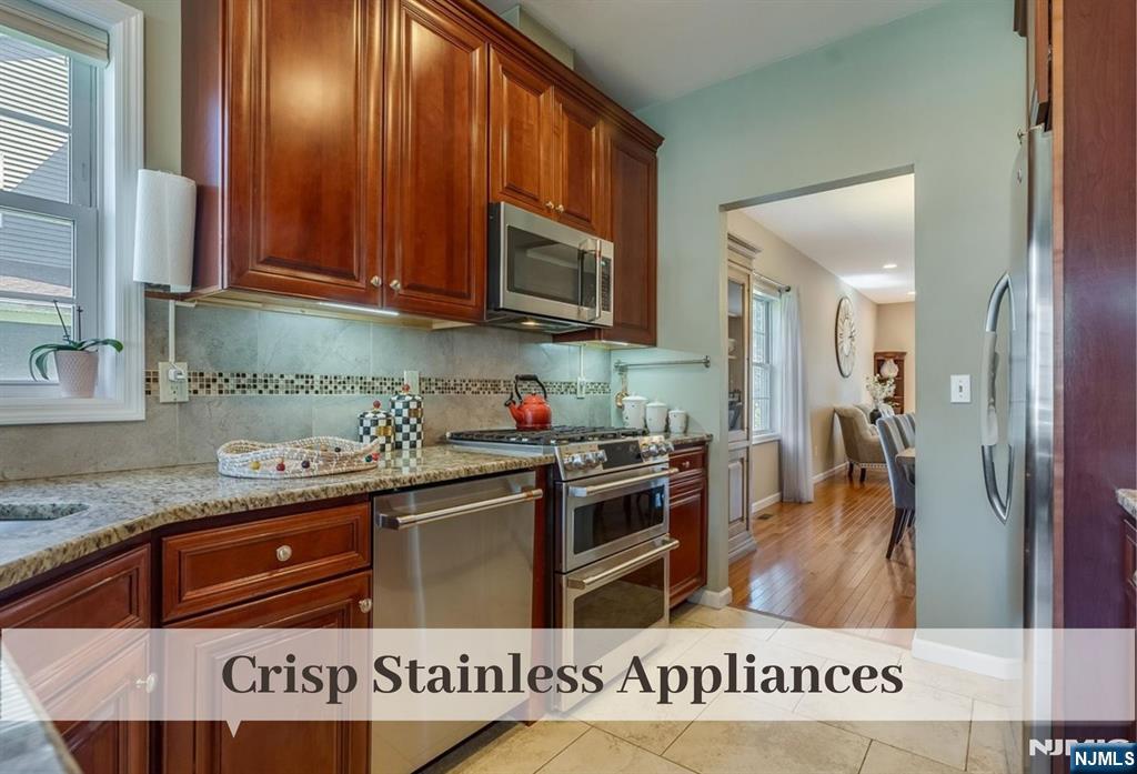 80 West Prospect Street Waldwick, NJ 07463 - Photo 7 of 50 a kitchen with stainless steel appliances granite countertop a stove and a sink