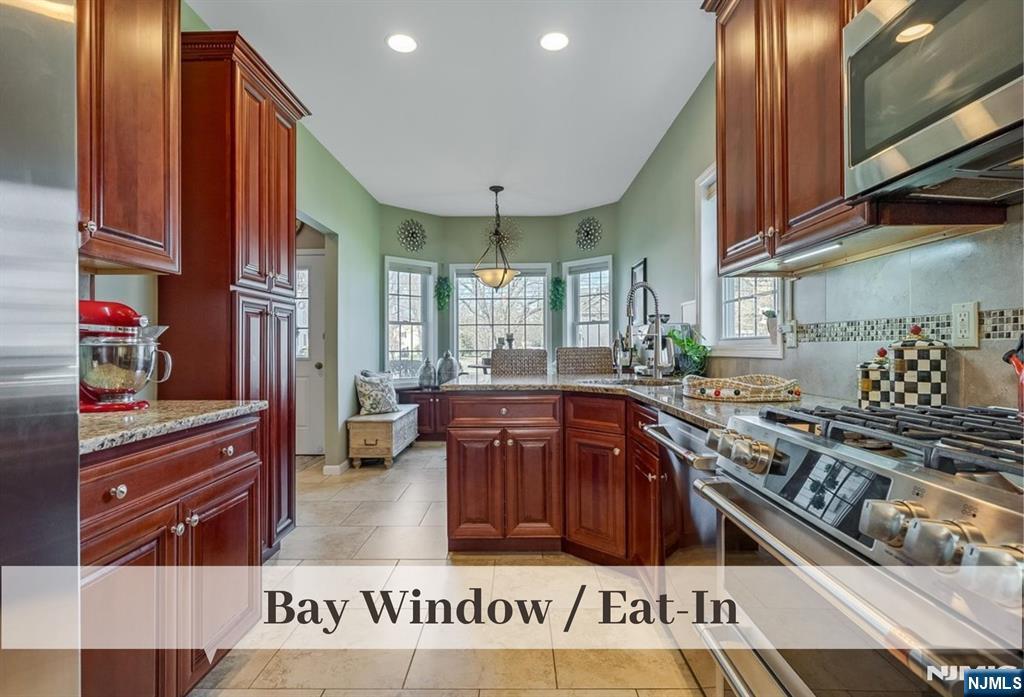 80 West Prospect Street Waldwick, NJ 07463 - Photo 8 of 50 a kitchen with stainless steel appliances granite countertop a stove and a sink
