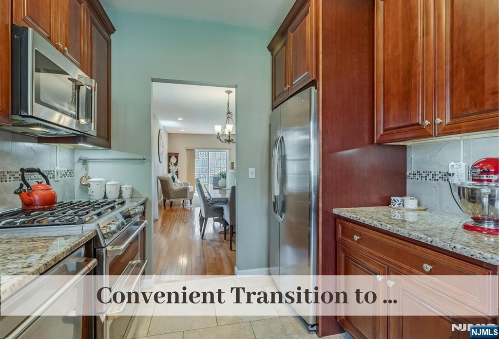 80 West Prospect Street Waldwick, NJ 07463 - Photo 10 of 50 a kitchen with stainless steel appliances granite countertop a refrigerator a stove and a sink