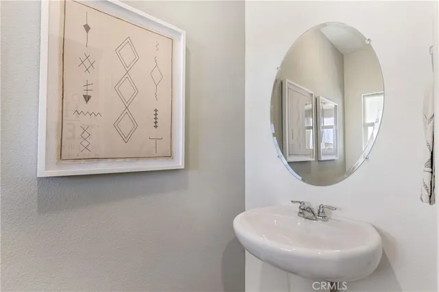 a bathroom with a sink and mirror