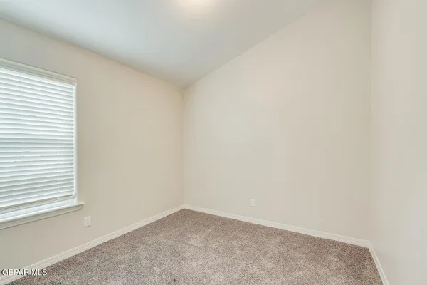 an empty room with a empty space and windows