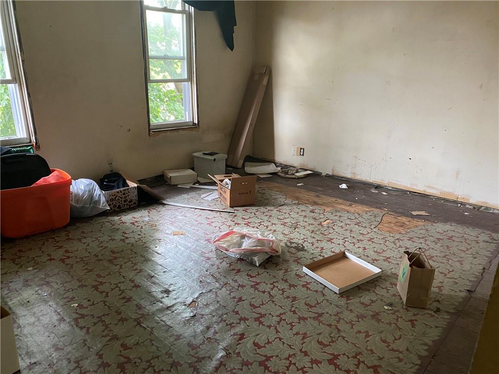 411 East Washington Street Rochester, PA 15074 - Photo 9 of 11 a living room with couch and a window