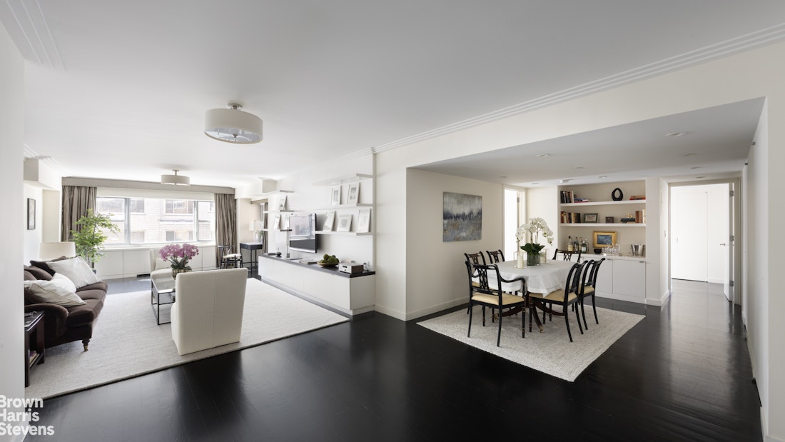 27 East 65th Street, Unit 11D Manhattan, NY 10065 - Photo 4 of 15 a view of a dining room with furniture and wooden floor