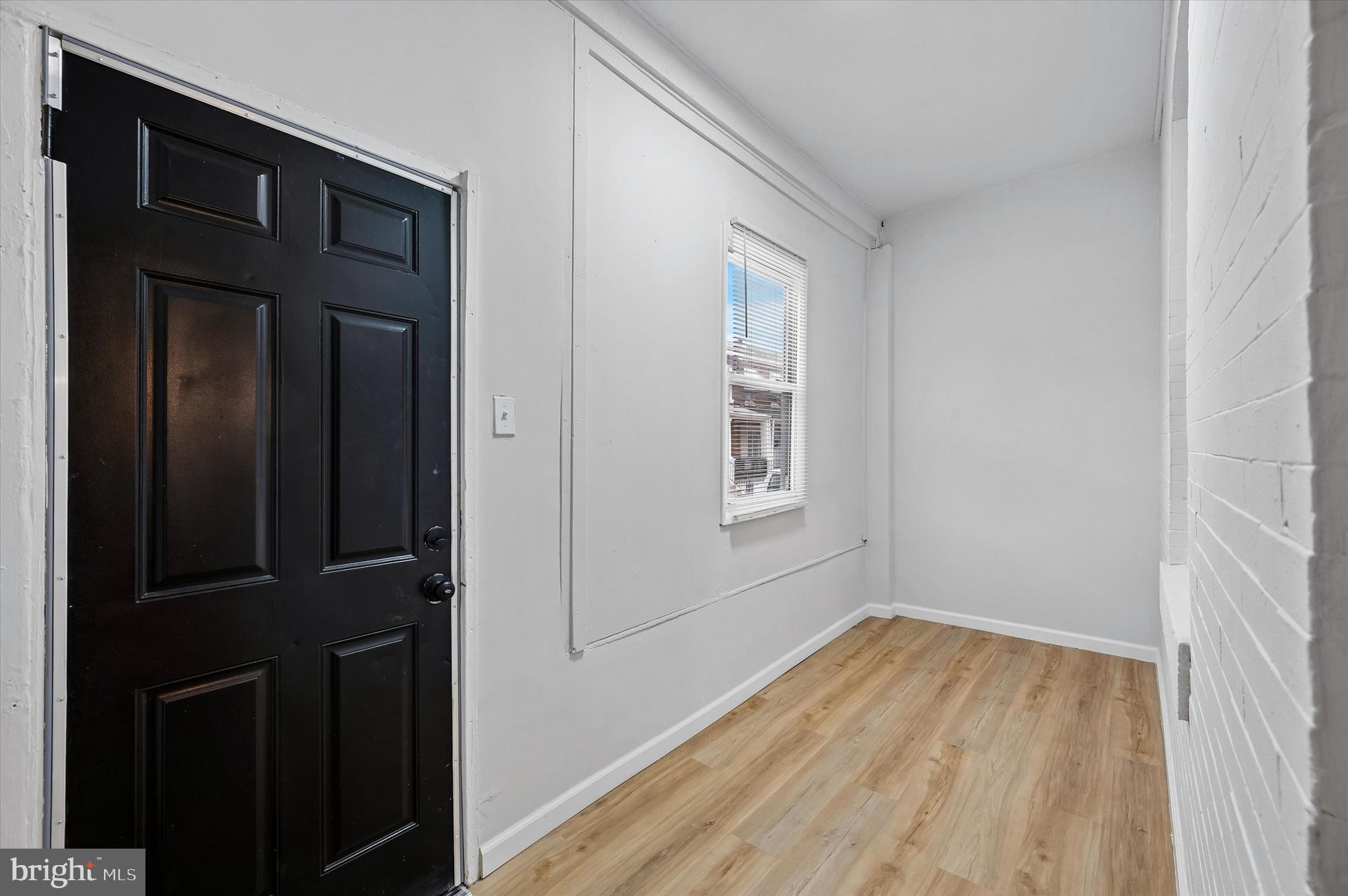 2433 South Millick Street Philadelphia, PA 19142 - Photo 2 of 15 wooden floor in an empty room