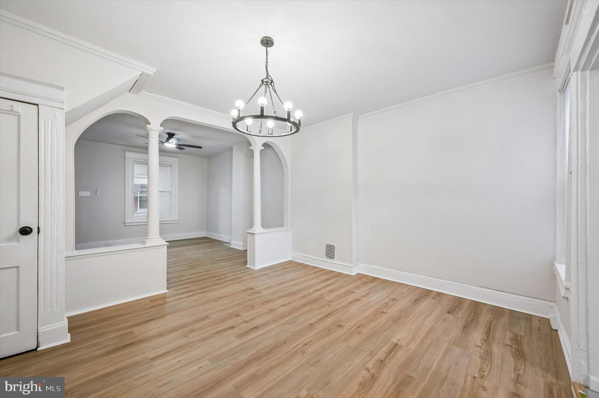2433 South Millick Street Philadelphia, PA 19142 - Photo 6 of 15 a view of empty room with wooden floor