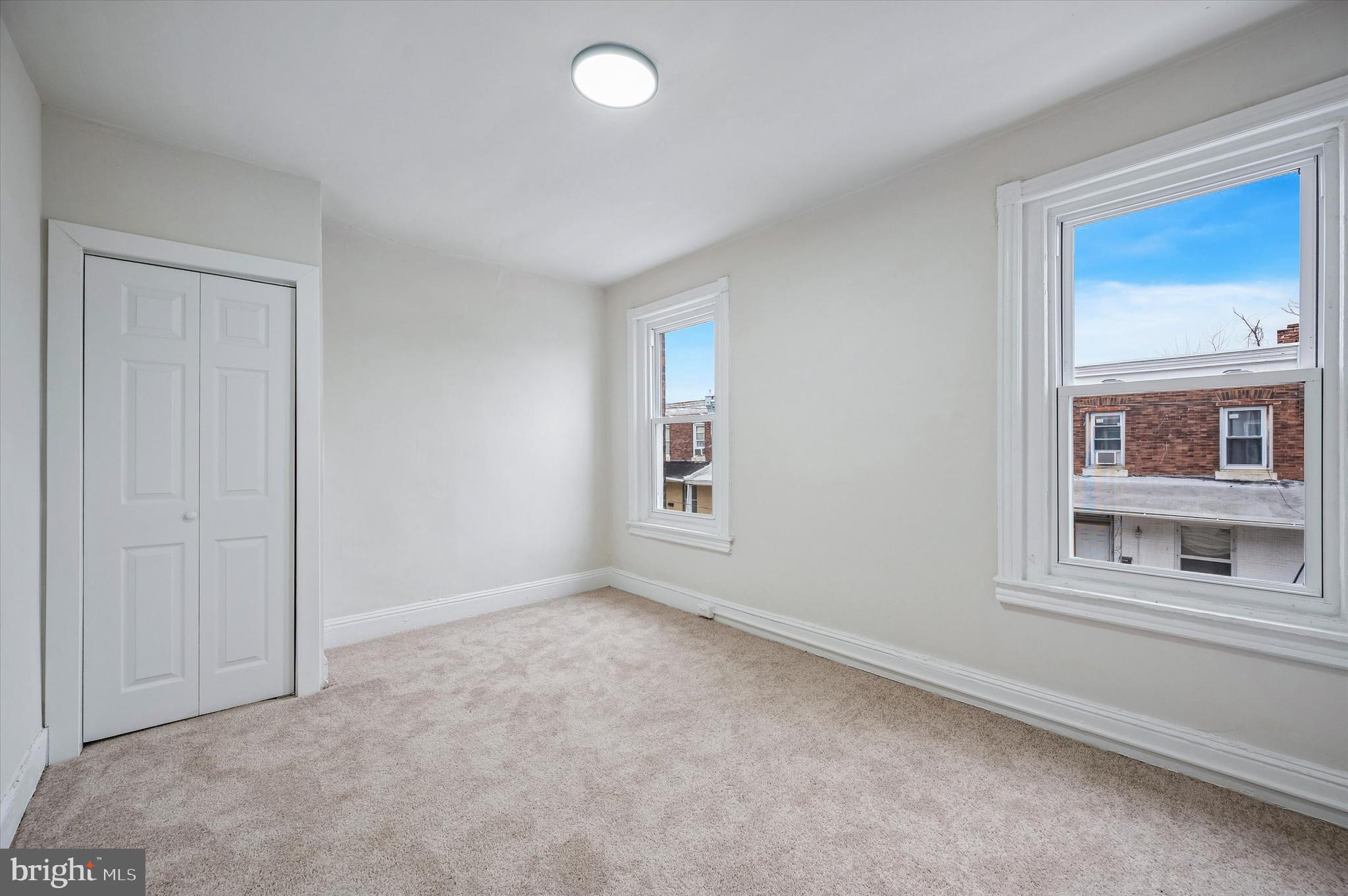 2433 South Millick Street Philadelphia, PA 19142 - Photo 10 of 15 a view of an empty room with a window