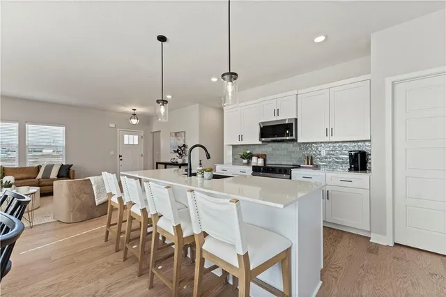 $415,950 | 411 Woodview Drive, Raymore, MO 64083