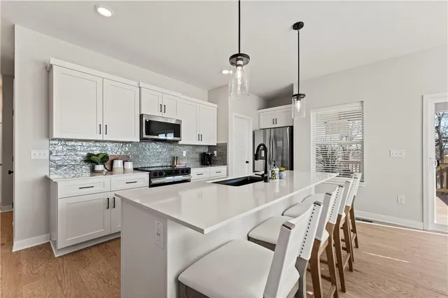 $415,950 | 411 Woodview Drive, Raymore, MO 64083