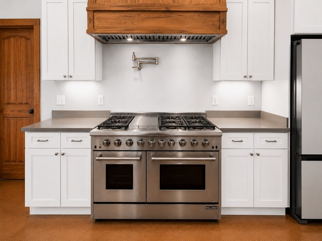 161 Balsly Road East Center Point, TX 78010 - Photo 13 of 28 a stove top oven sitting inside of a kitchen