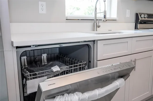 a kitchen with a sink and cabinets