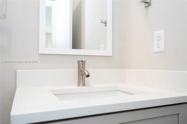 a bathroom with a bathtub and a sink