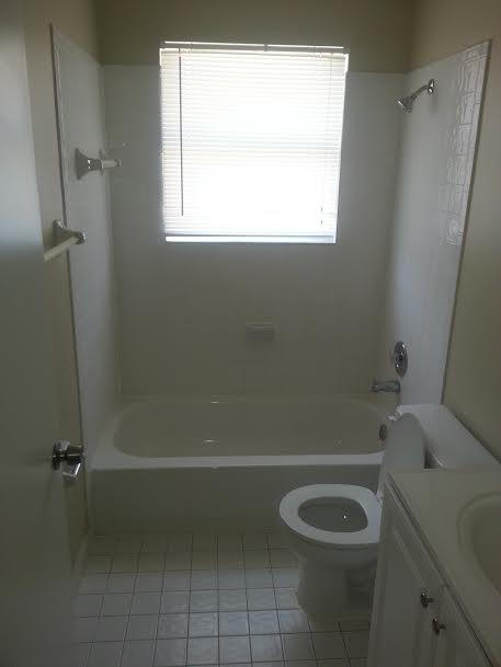 7434 Michigan Isle Road Lake Worth, FL 33467 - Photo 12 of 23 a bathroom with a toilet and a shower