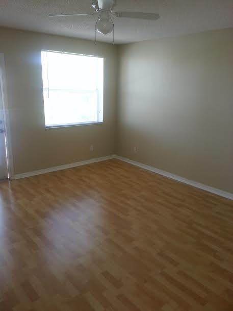 7434 Michigan Isle Road Lake Worth, FL 33467 - Photo 14 of 23 an empty room with a window