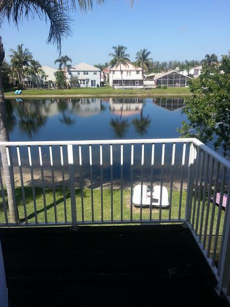 7434 Michigan Isle Road Lake Worth, FL 33467 - Photo 17 of 23 a view of a lake from a balcony