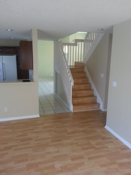 7434 Michigan Isle Road Lake Worth, FL 33467 - Photo 21 of 23 a view of entryway and hall with wooden floor