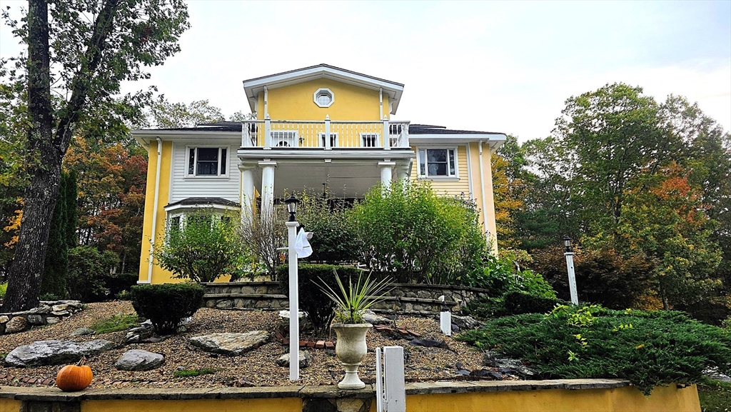 a front view of a house with yard