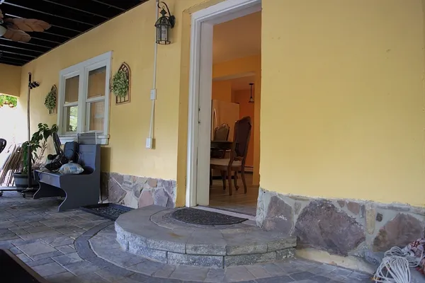 a backyard of a house with lots of green space