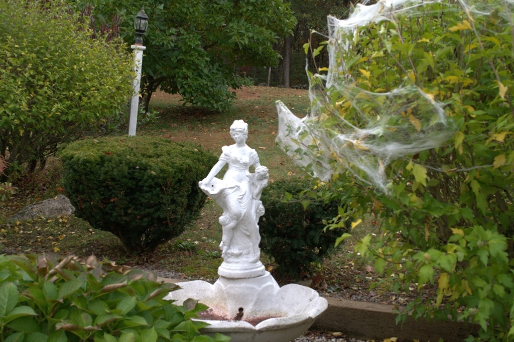 85 Burlingame Road, Unit 1 Charlton, MA 01507 - Photo 30 of 31 a view of a yard with plants