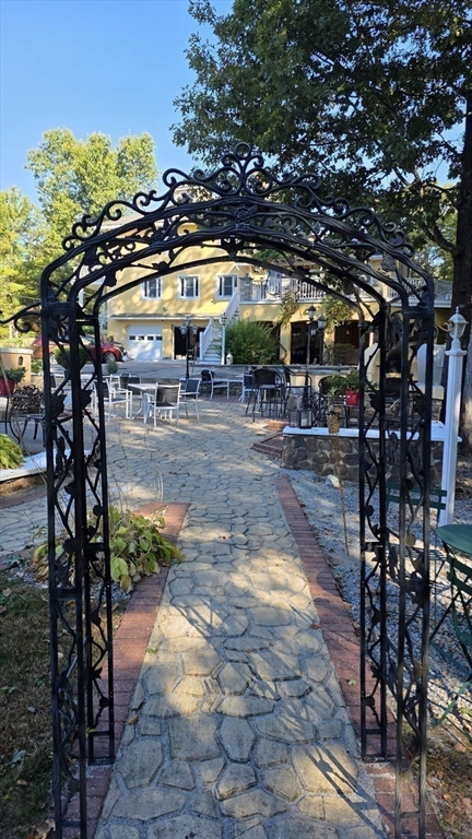 85 Burlingame Road, Unit 1 Charlton, MA 01507 - Photo 5 of 31 a view of yard along with trees