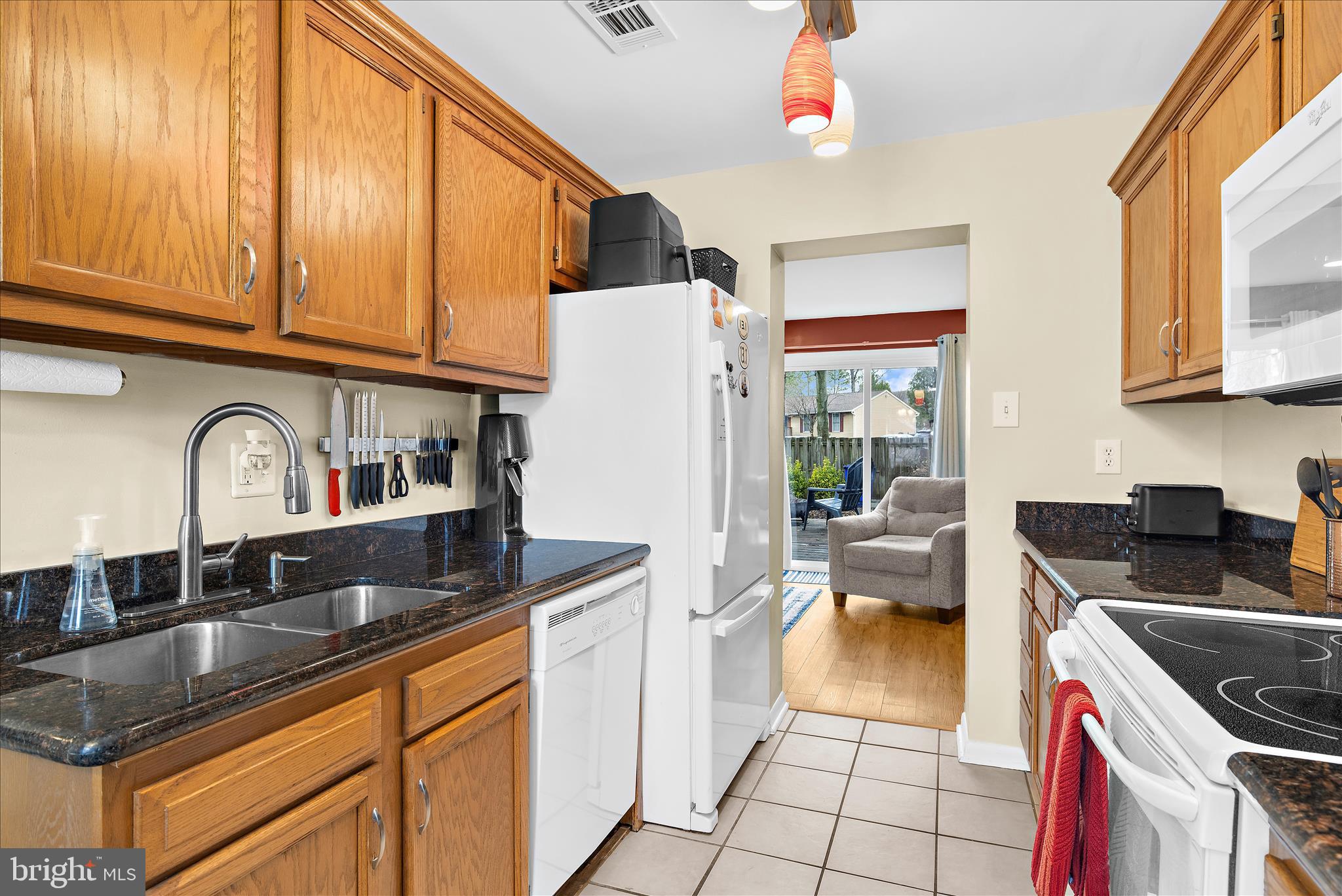 47 Vienna Court Frederick, MD 21702 - Photo 12 of 47 a kitchen with stainless steel appliances granite countertop a sink stove and refrigerator