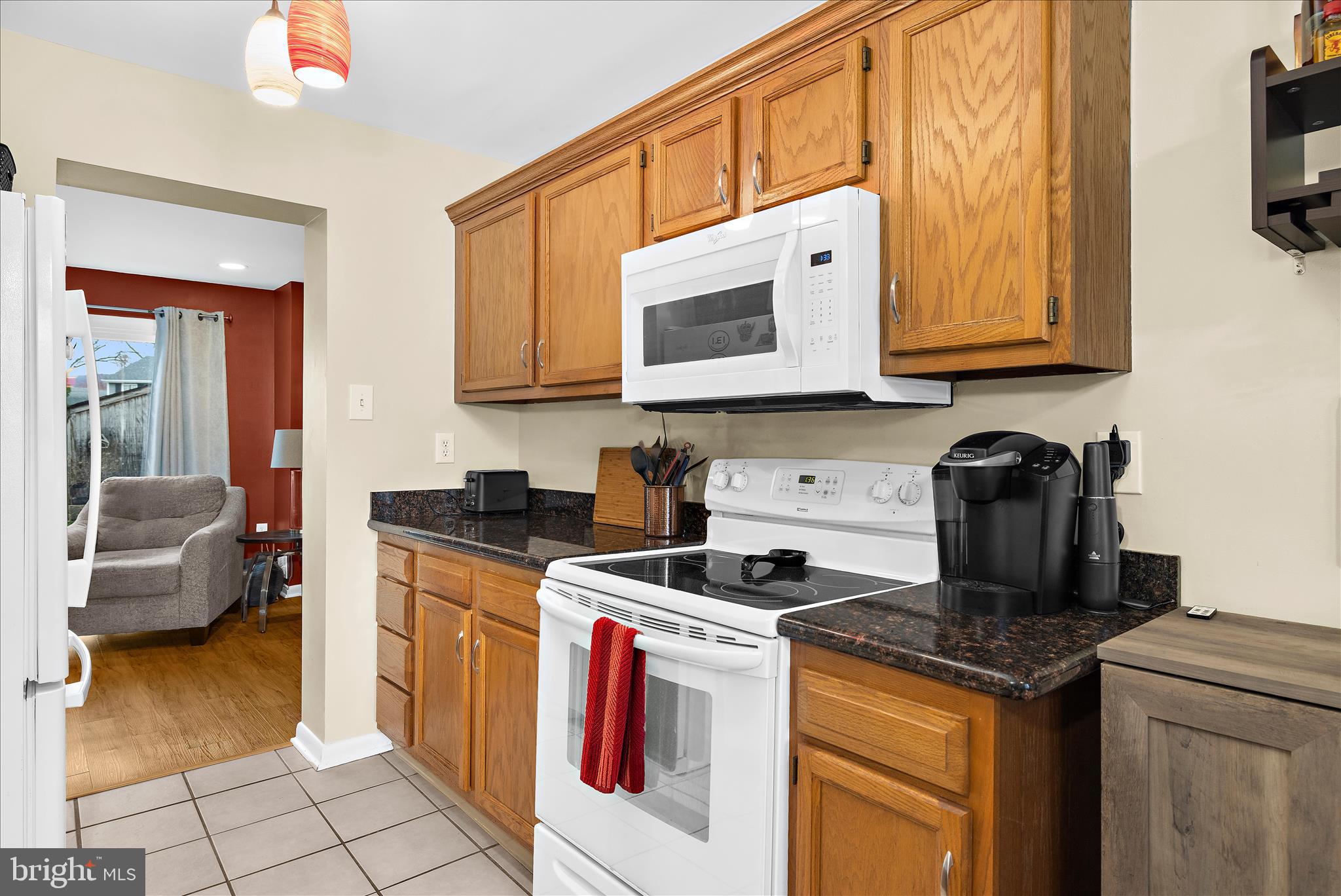 47 Vienna Court Frederick, MD 21702 - Photo 13 of 47 a kitchen with stainless steel appliances granite countertop a stove a sink and a microwave