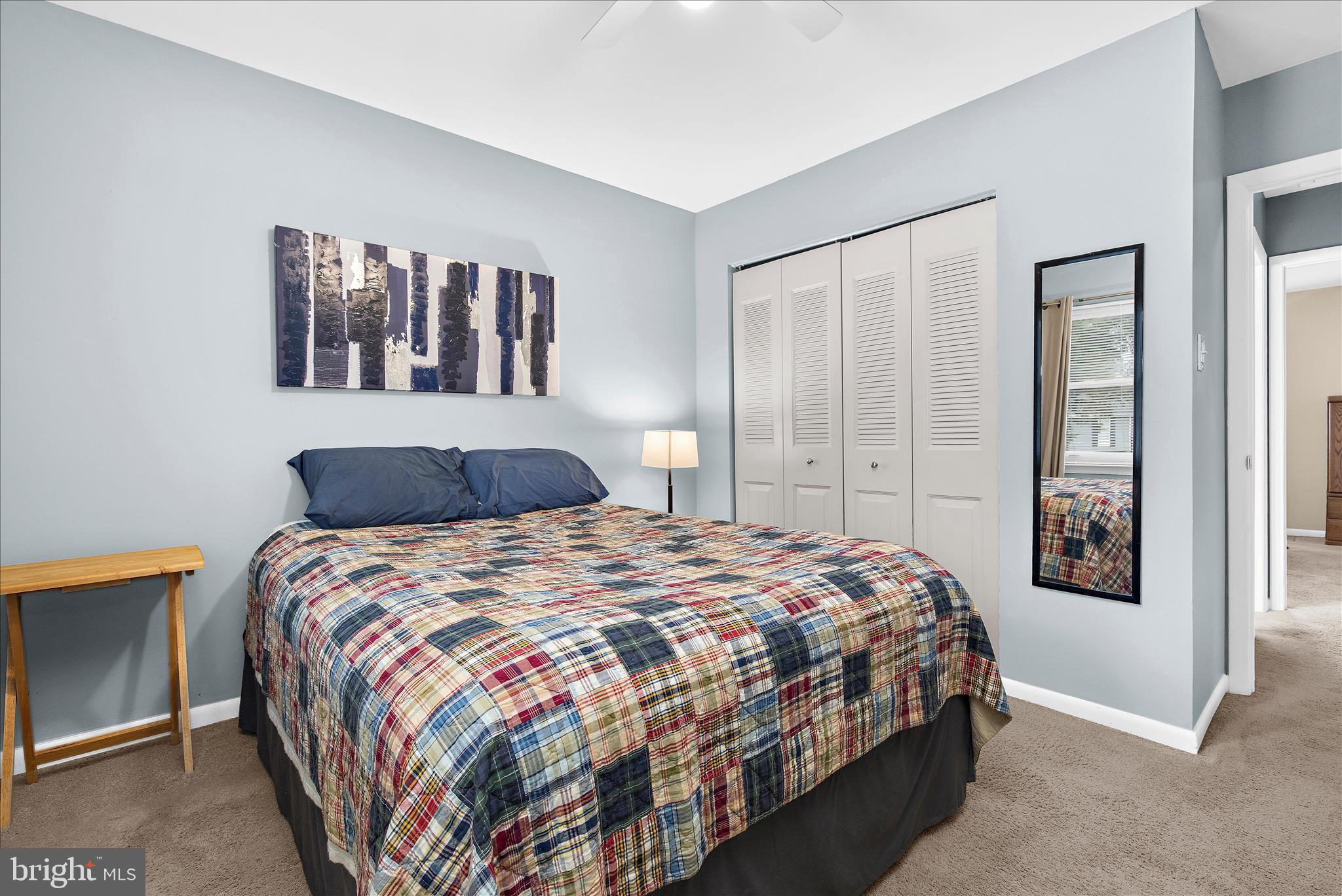 47 Vienna Court Frederick, MD 21702 - Photo 25 of 47 a bedroom with a large bed and a chandelier