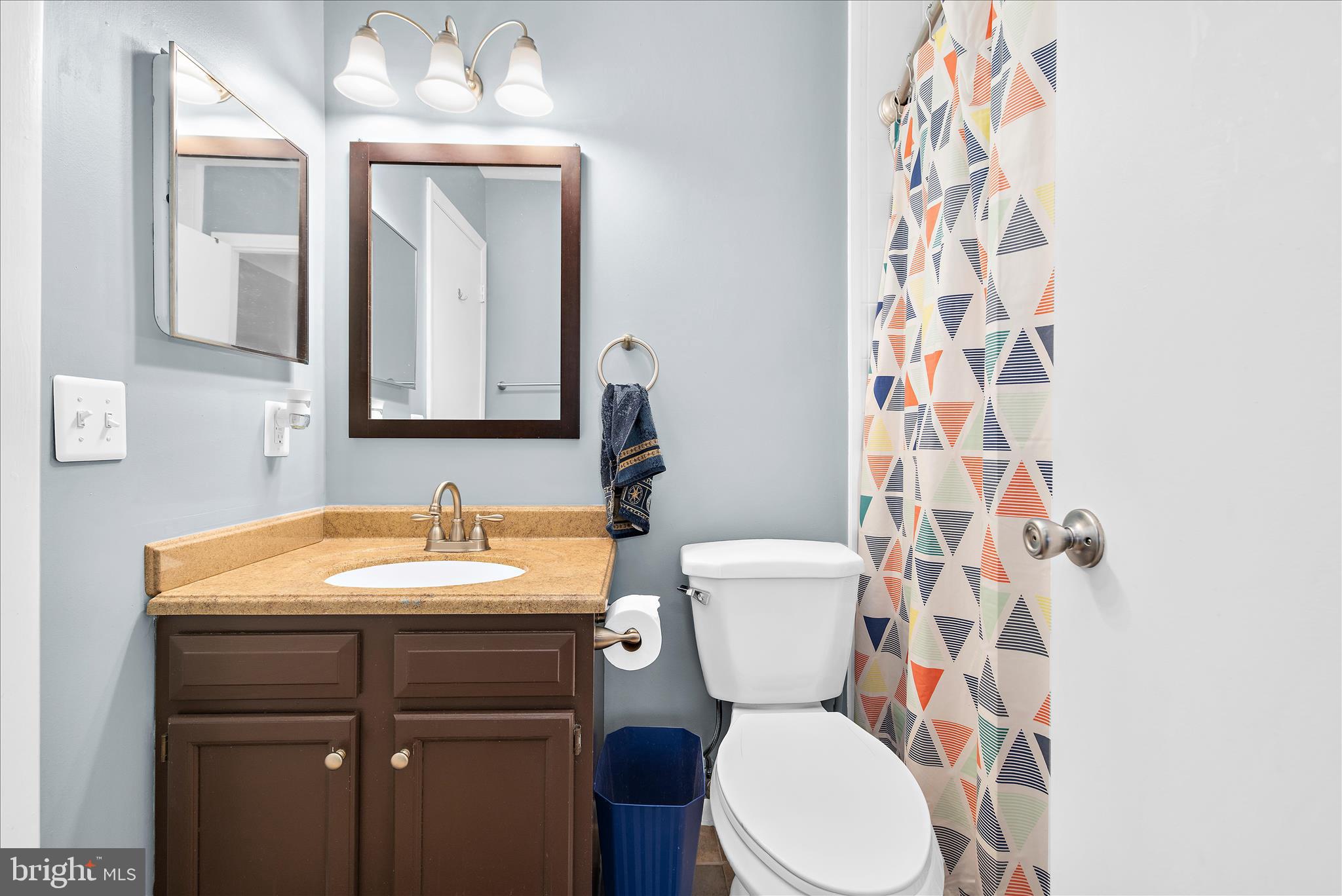47 Vienna Court Frederick, MD 21702 - Photo 28 of 47 a bathroom with a toilet a sink and a mirror