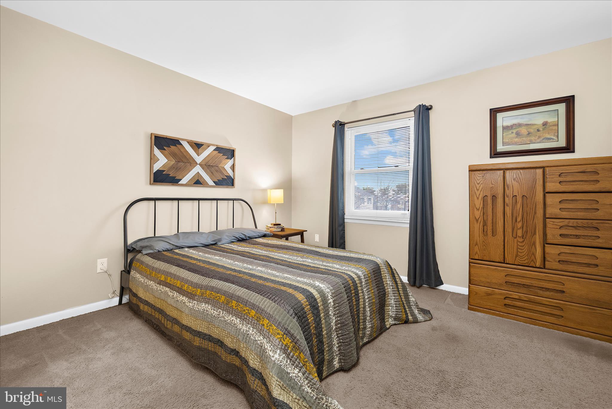 47 Vienna Court Frederick, MD 21702 - Photo 29 of 47 a bedroom with a bed and a wall painting