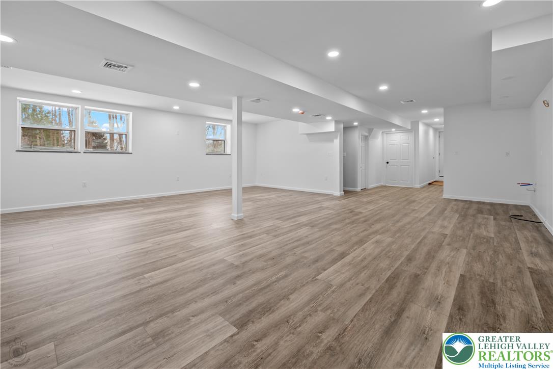 1111 Delabole Jct Road Pen Argyl, PA 18072 - Photo 20 of 26 a view of an empty room with wooden floor