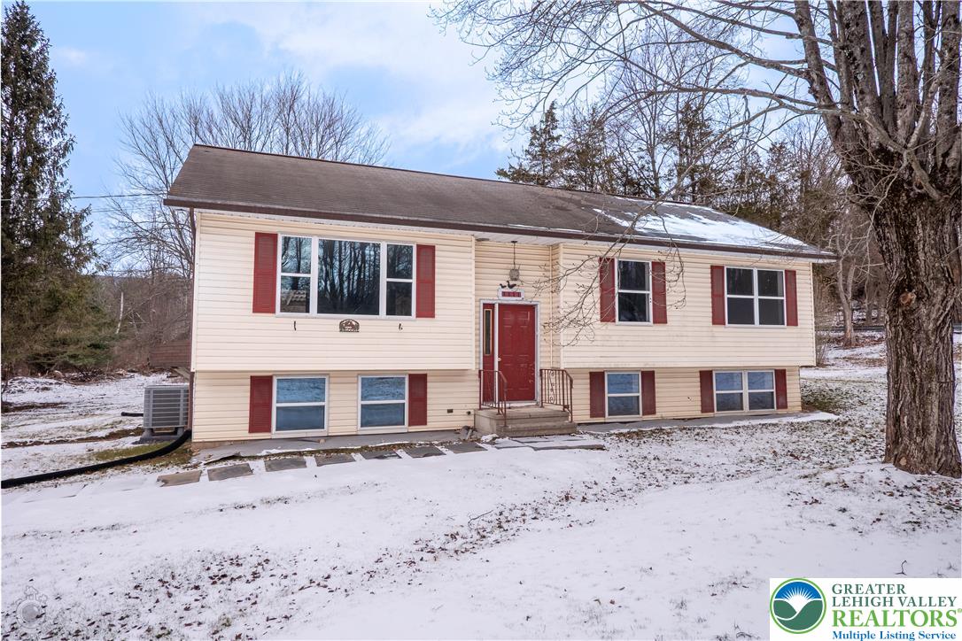 1111 Delabole Jct Road Pen Argyl, PA 18072 - Photo 2 of 26 a front view of a house with a yard