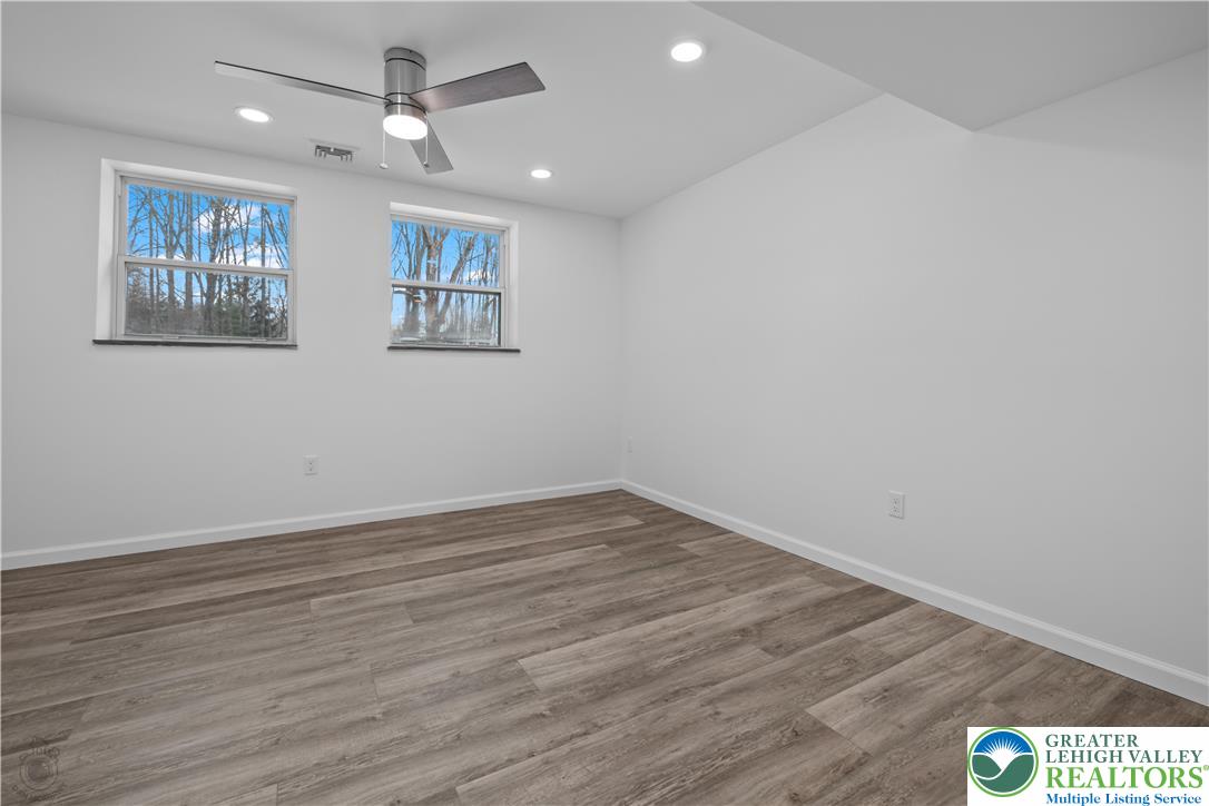 1111 Delabole Jct Road Pen Argyl, PA 18072 - Photo 23 of 26 wooden floor in an empty room with a window